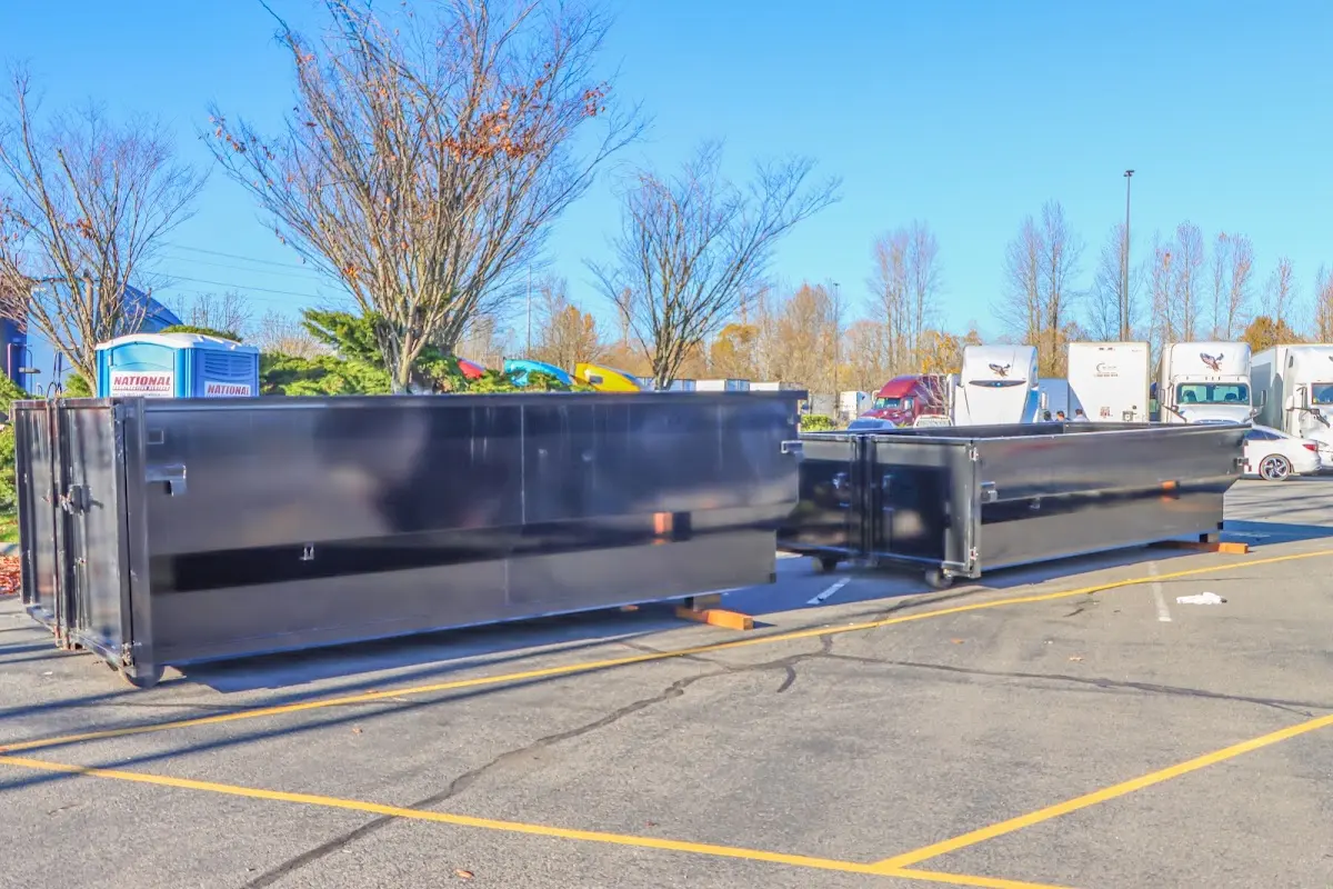 Professional dumpster rental service with roll-off container on residential driveway in Strongsville